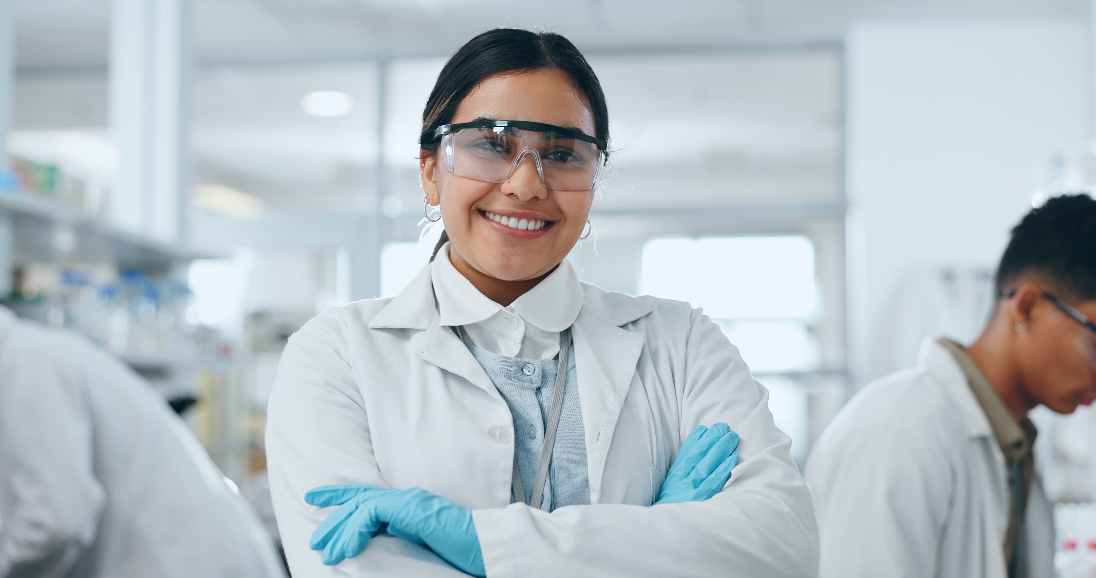 smiling-scientist-in-lab-coat-with-arms-crossed-2026-09-24-12-54-08-utc